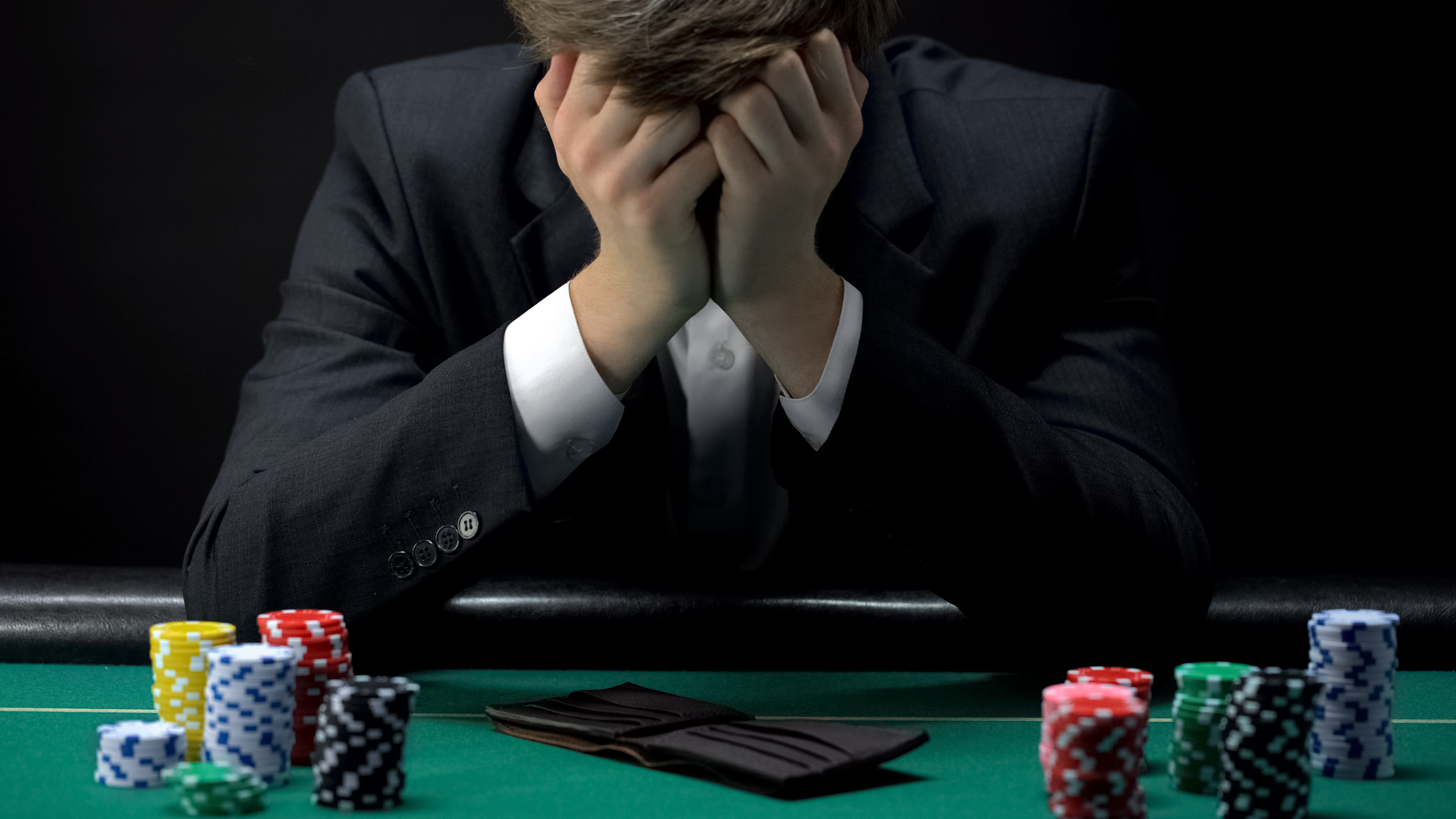 Man losing at a game of poker
