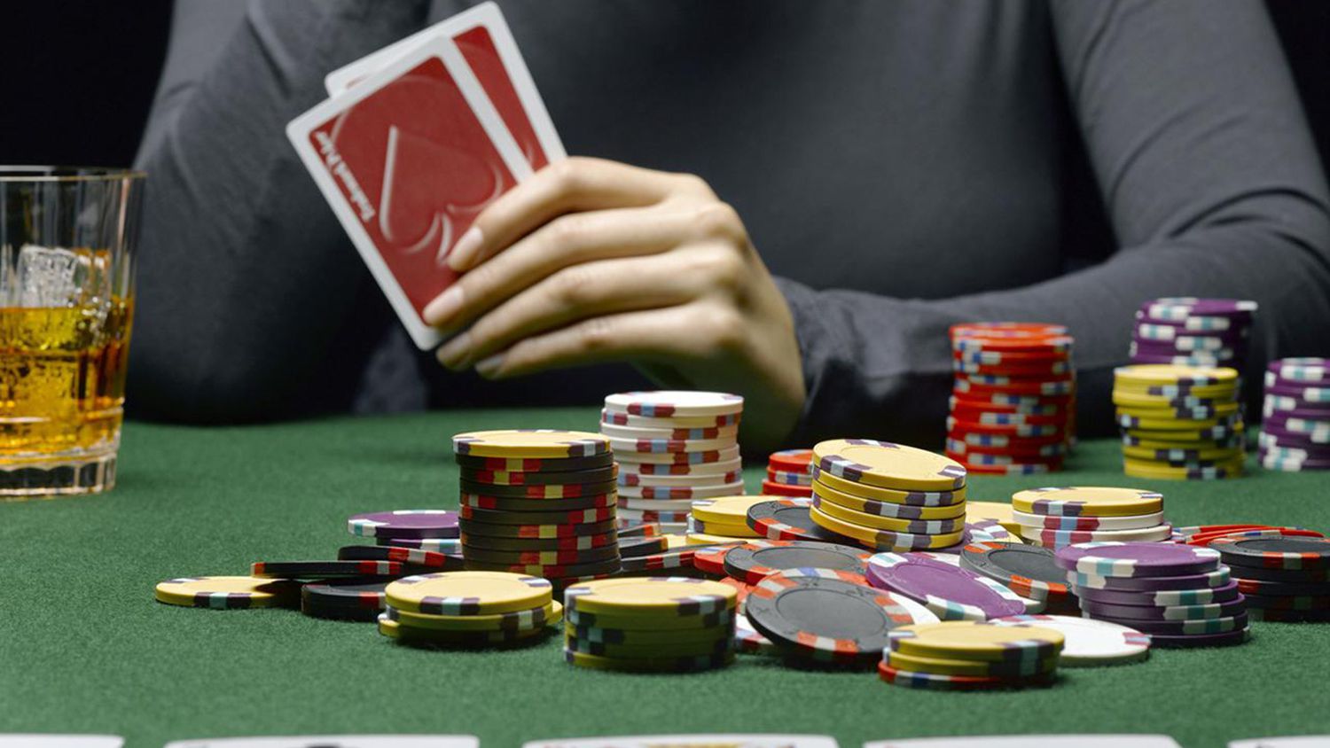 Man playing poker with stack of chips